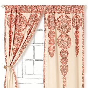 Anthropologie Marrakech curtain in rust-colored design